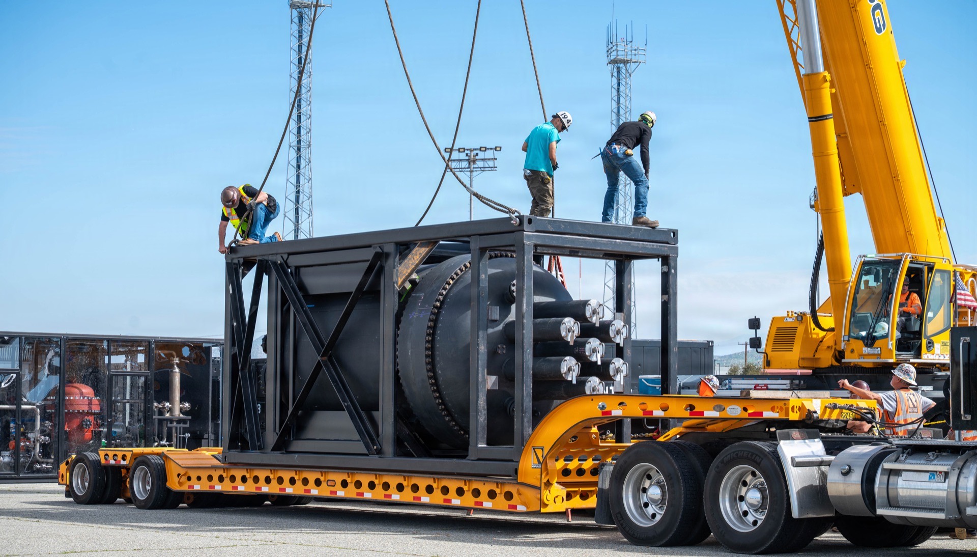 Large nuclear reactor component being transported on specialized heavy-haul vehicle