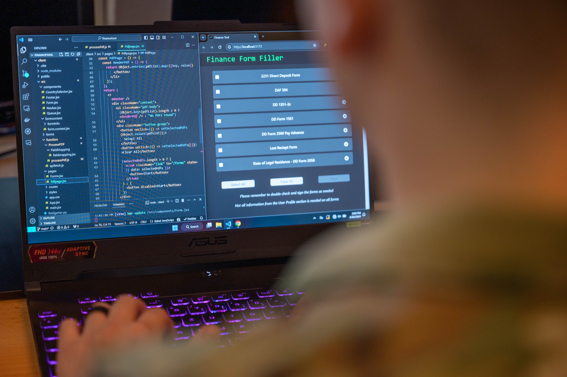 Software developer writing code on laptop with IDE open during active development session